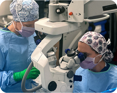 close up view of ophthalmology doctors performing surgery in operation room