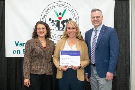 Wellness program manager Mima Roberts receives MAHHC’s 2024 Worksite Wellness award at the Worksite Wellness Awards and Conference.