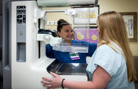 Two members of the Department of Radiology with Mt. Ascutney Hospital and Health Center’s mammography system. 