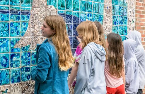 Children view the Mosaic mural