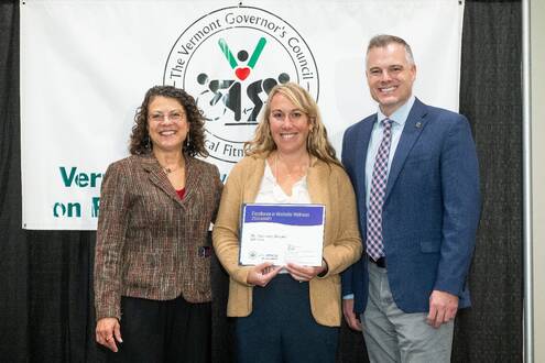 Wellness program manager Mima Roberts receives MAHHC’s 2024 Worksite Wellness award at the Worksite Wellness Awards and Conference.